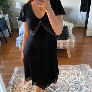 Black dress with cool dangly embellishments around the bust, Timeless dress